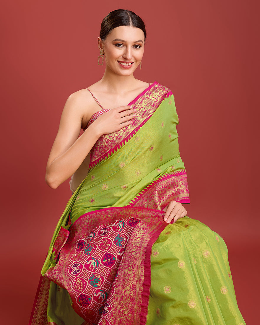 Monjolika Fashion Exquisite Designs With This Regal Parrot Green Patola Pallu Banarasi Tissue Silk Saree | Grocsy