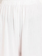 TAG 7 Women White Solid Flared Palazzos | Grocsy