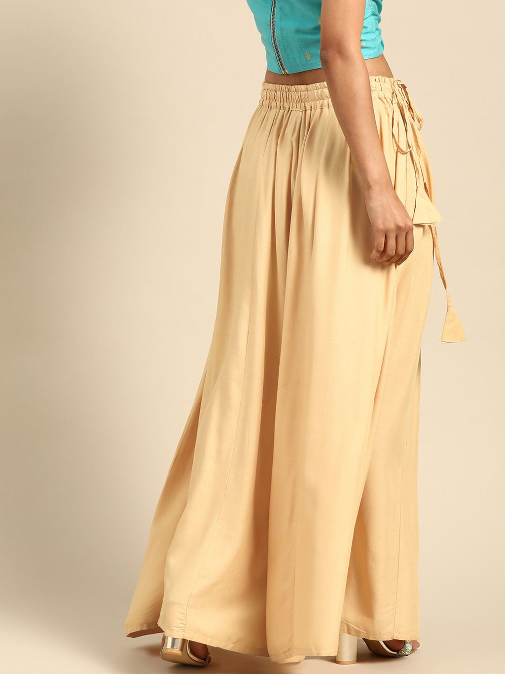 TAG 7 Women Beige Solid Flared Palazzos | Grocsy