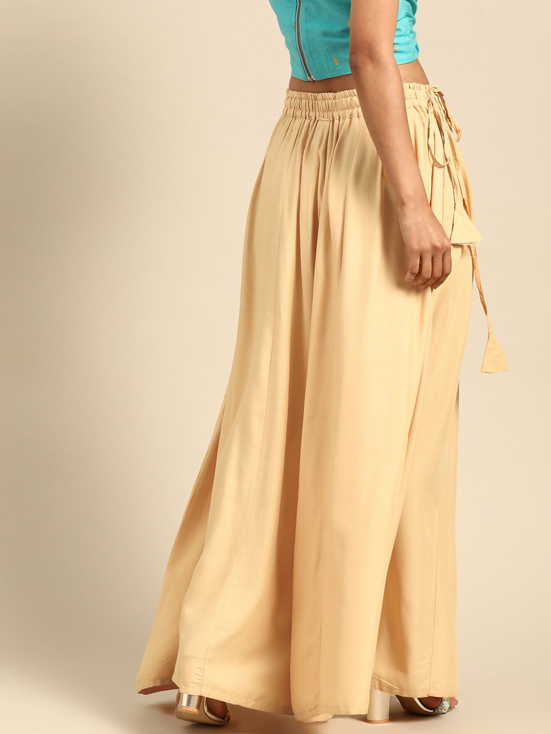 TAG 7 Women Beige Solid Flared Palazzos | Grocsy