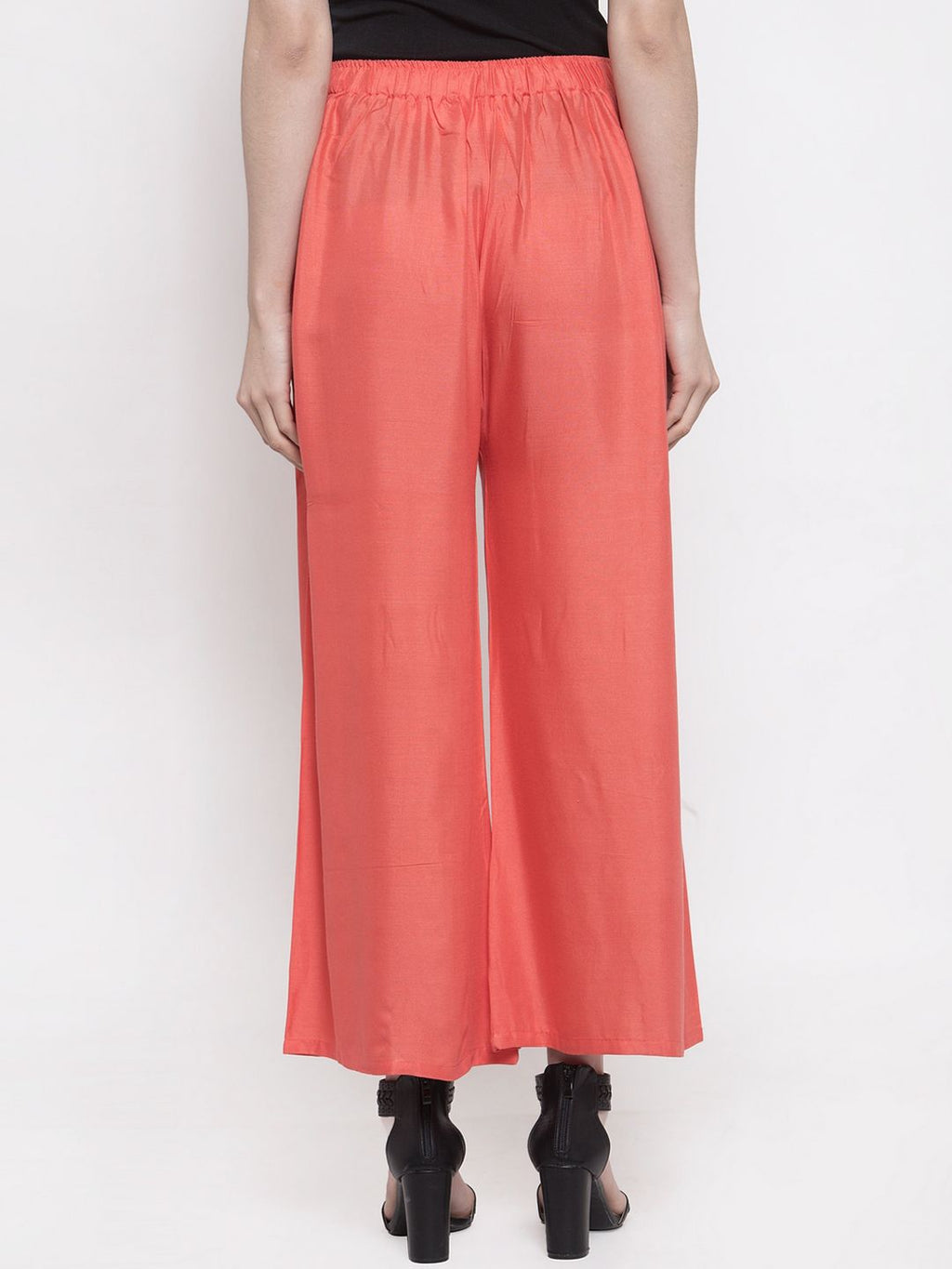 TAG 7 Women Peach-Coloured Solid Flared Palazzos | Grocsy