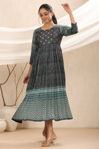 Juniper Bottle Green Muslin Festive Printed Flared Dress For Women | Grocsy