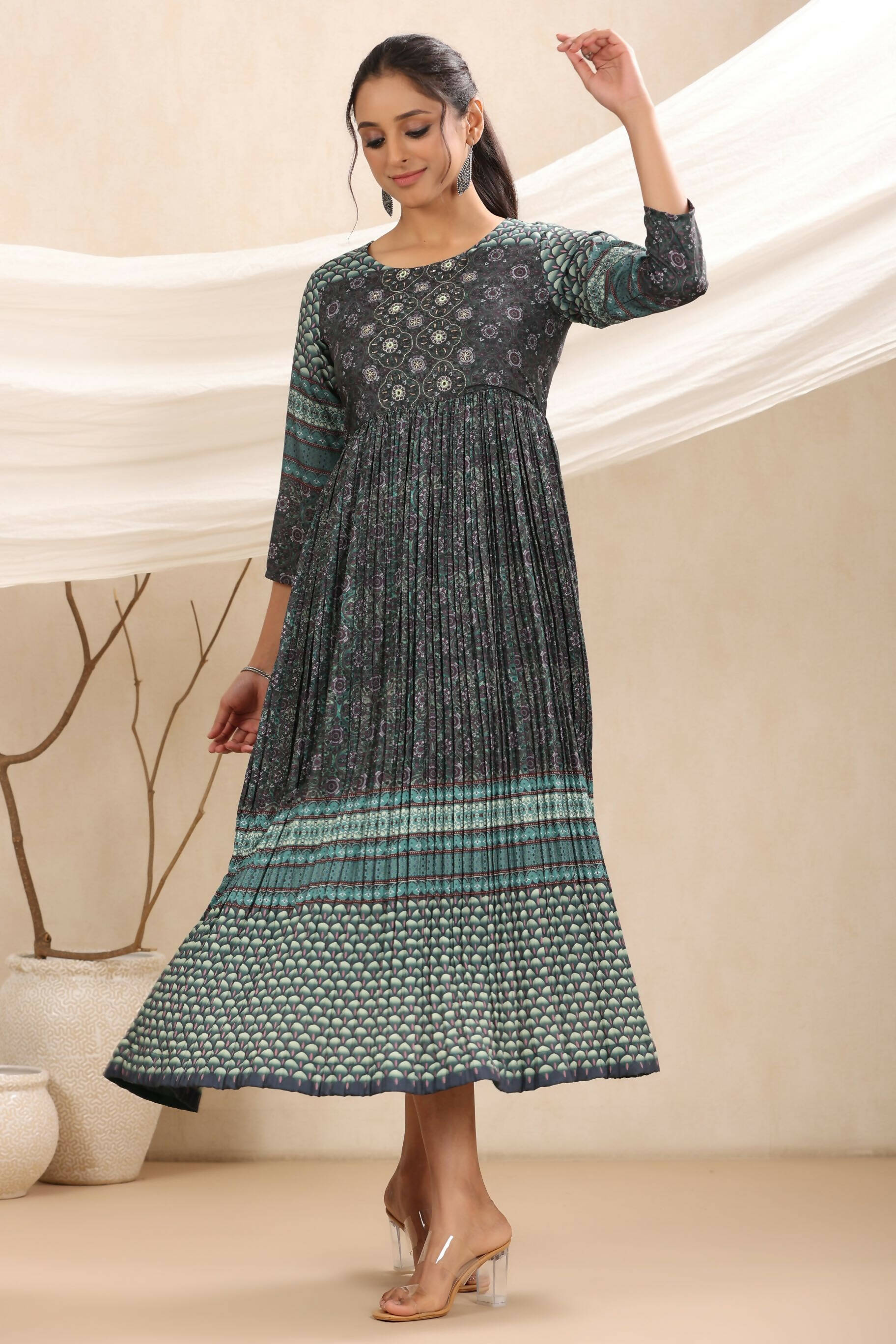 Juniper Bottle Green Muslin Festive Printed Flared Dress For Women | Grocsy