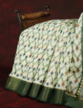Half White And Parrot Green Colour Ikat Design Semi Chanderi Saree By Gayathri Reddy Designer Studio | Grocsy