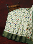 Half White And Parrot Green Colour Ikat Design Semi Chanderi Saree By Gayathri Reddy Designer Studio | Grocsy