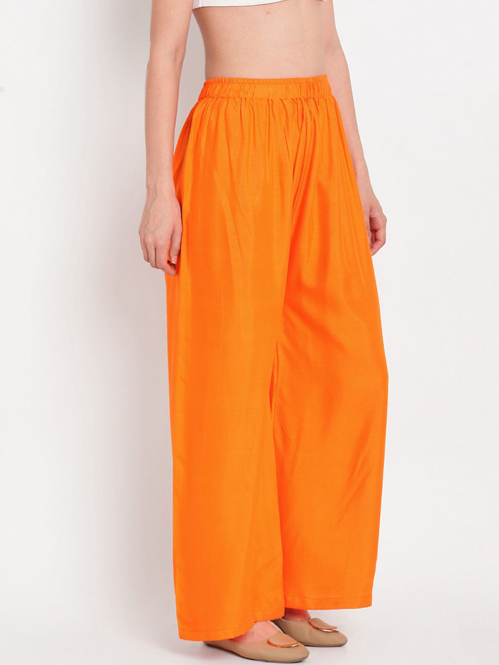 TAG 7 Women Orange Solid Flared Palazzos | Grocsy