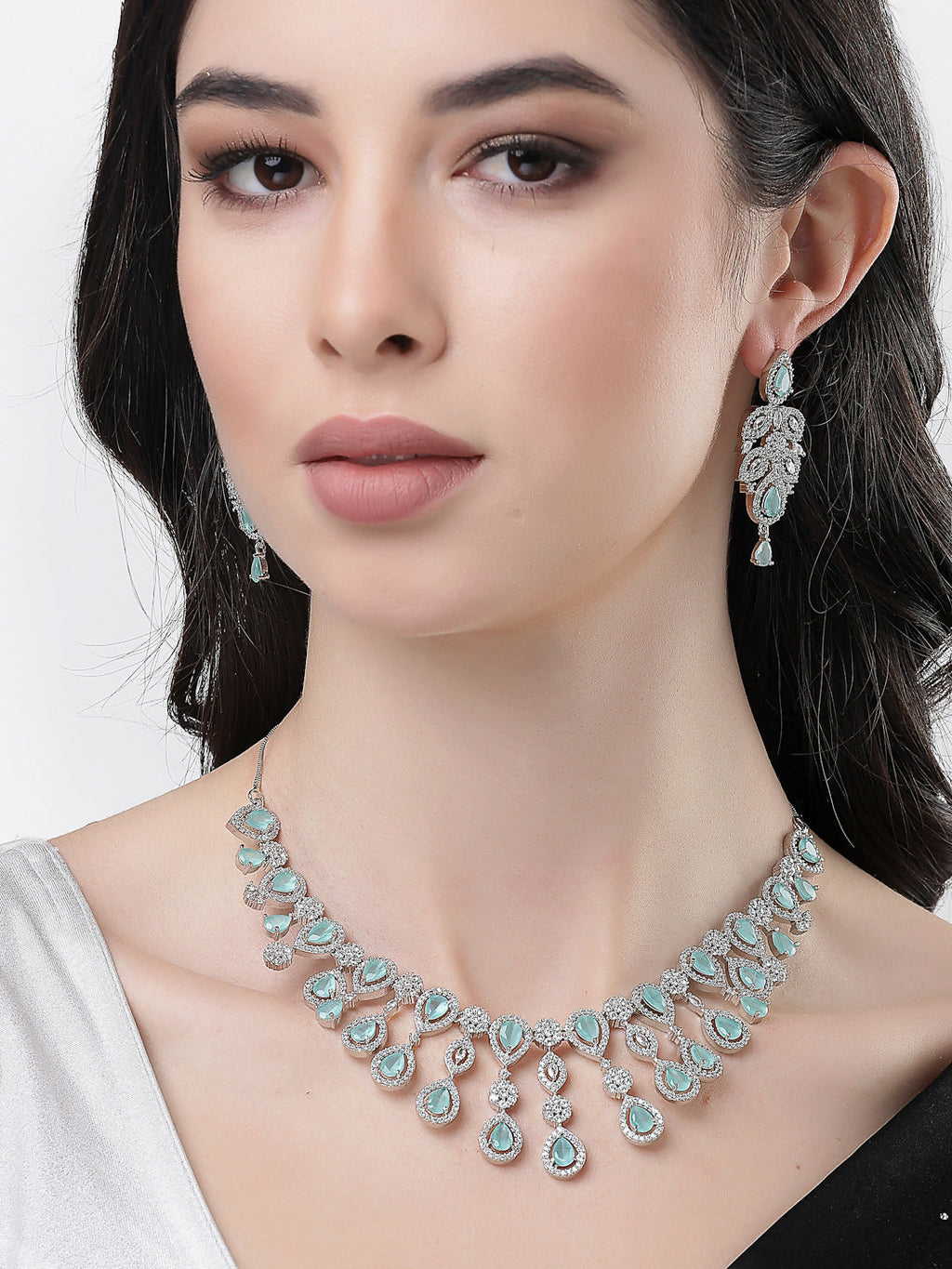 NVR Women's silver plated Turquoise CZ stone handcrafted jewellery set | Grocsy