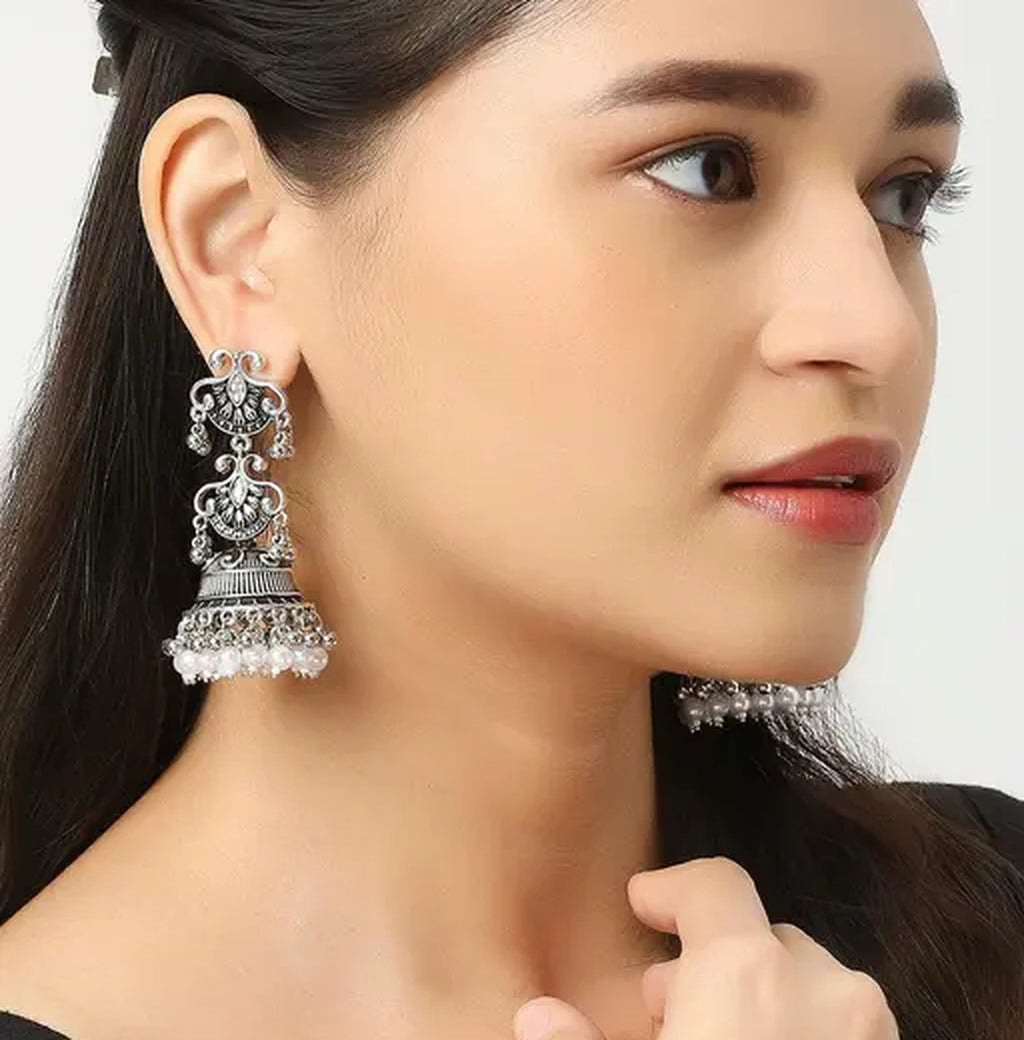 Jewel City Vintage Oxidized Silver Jhumka Earrings with Pearl and Red Bead Accents | Grocsy
