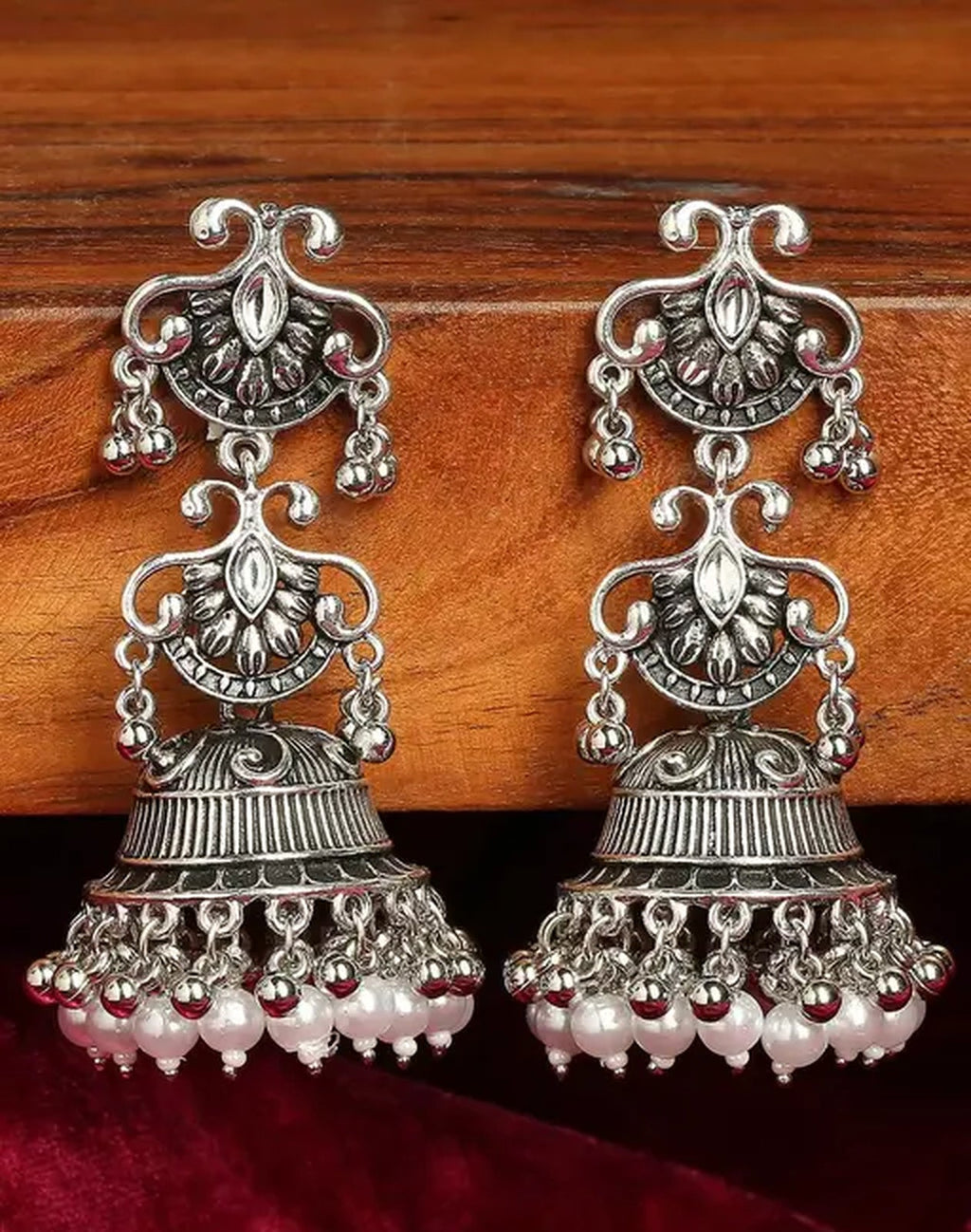 Jewel City Vintage Oxidized Silver Jhumka Earrings with Pearl and Red Bead Accents | Grocsy