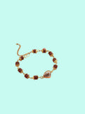NVR Women's Gold Toned Rudraksh & Pearls Bracelet | Grocsy