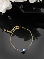 NVR Women Gold-Toned Evil Eye Rakhi With Roli Chawal | Grocsy