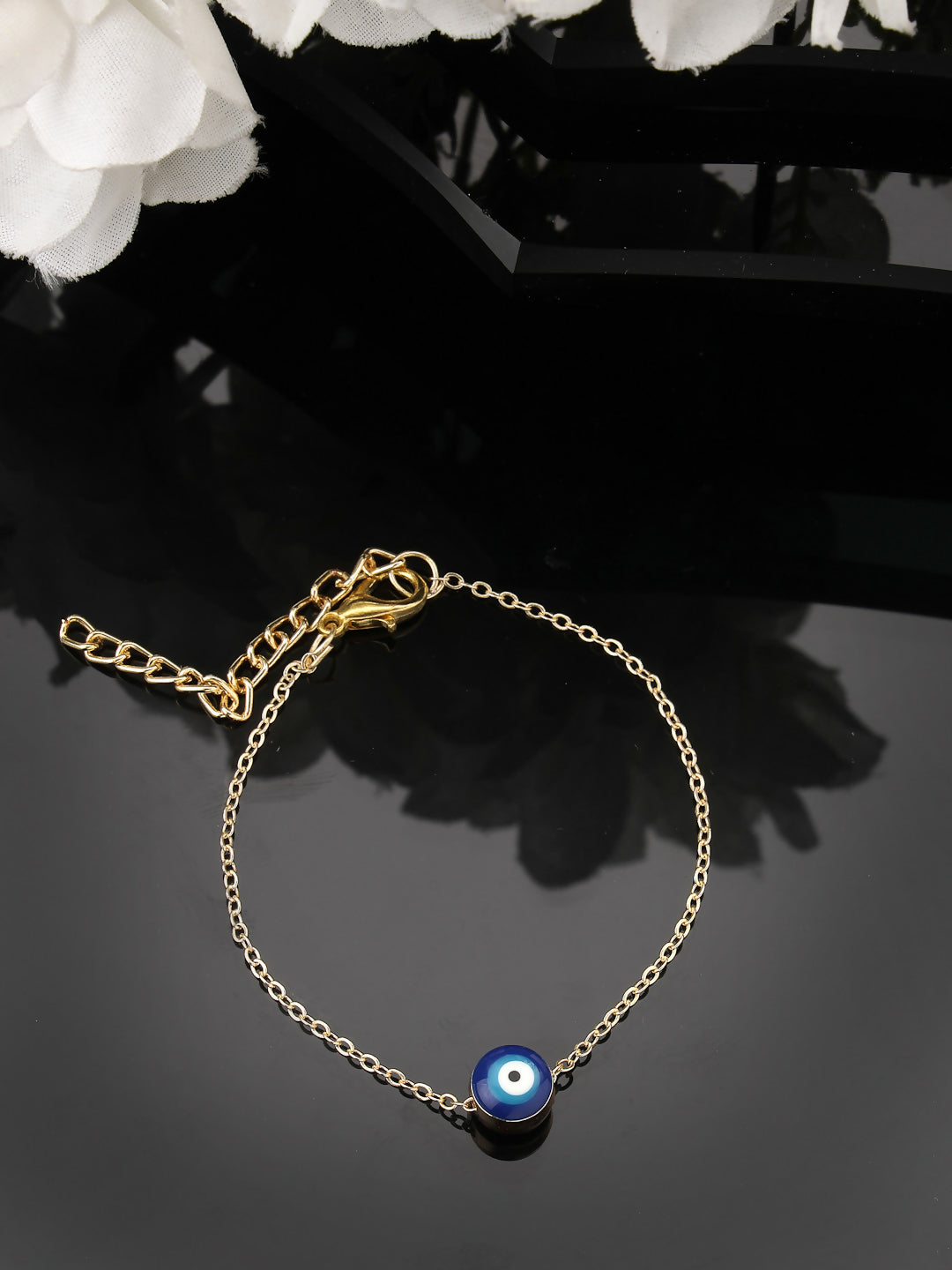 NVR Women Gold-Toned Evil Eye Rakhi With Roli Chawal | Grocsy