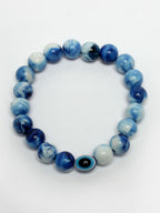 NVR Women & Men Set of 4 Multicolor Evil Eye Elasticated Rakhi With Roli Chawal | Grocsy