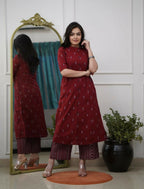 Teeya Creation Elegant Red Cotton Kurta Set Featuring Button Detail And Printed Palazzos | Grocsy