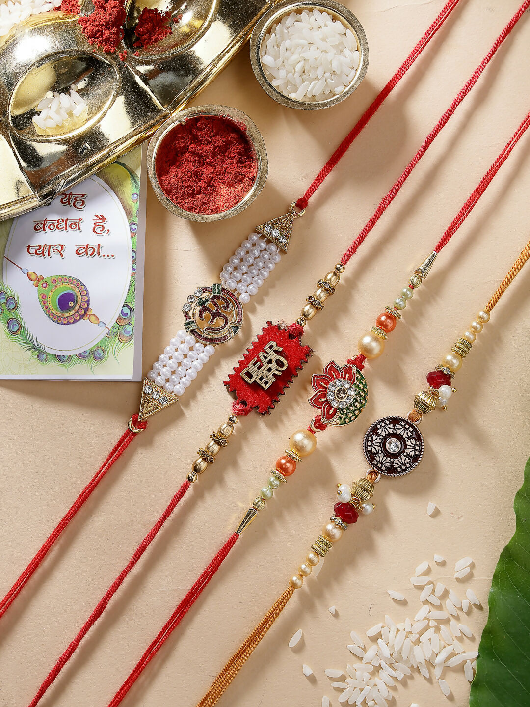 NVR Men Set of 4 Gold-Toned Stone-Studded & Beaded Rakhi With Roli Chawal | Grocsy