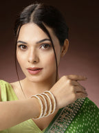 NVR Women's Set of 4 Gold-Polished Pearl Handcrafted Traditional Bangles | Grocsy