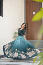 Vastranavya Teal Faux Blooming With Beads Embroidered work and Rich Floral Pedding Digital Print Gown | Grocsy