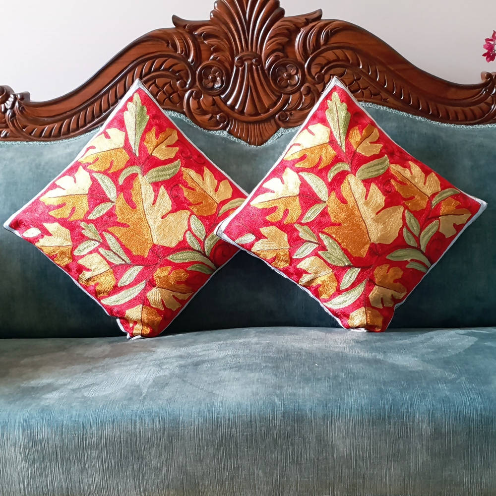 The Decor Nook Hand Embroidered Crewel Cushion Covers in Mustard Chinar Leaf Motif with Red Base | Grocsy