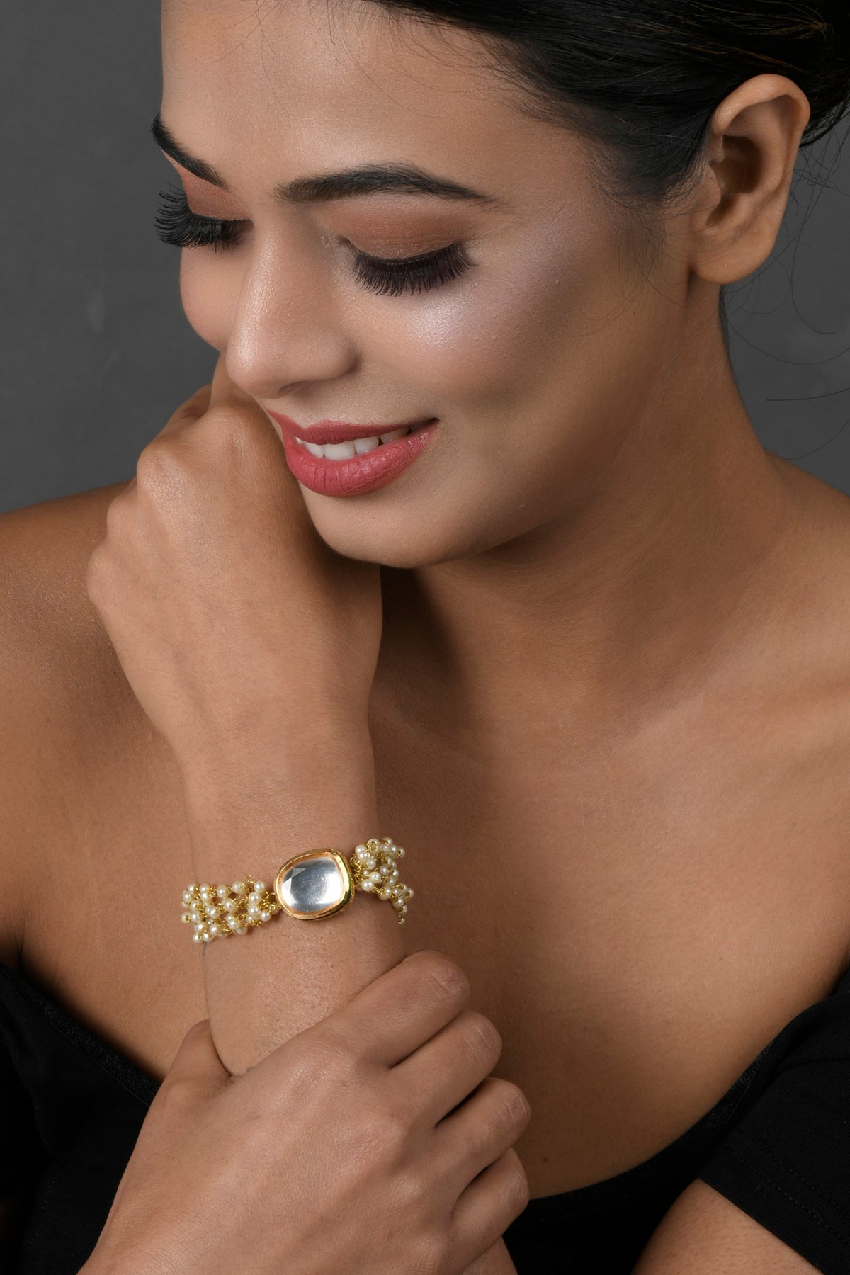 Peryl Women's Gold Toned White Kundan Charm Bracelet - Swadesiicart
