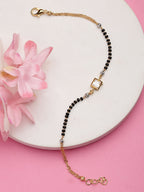 NVR Women Gold-Polished & Black Brass Stone-Studded Hand Mangalsutra Link Bracelet | Grocsy