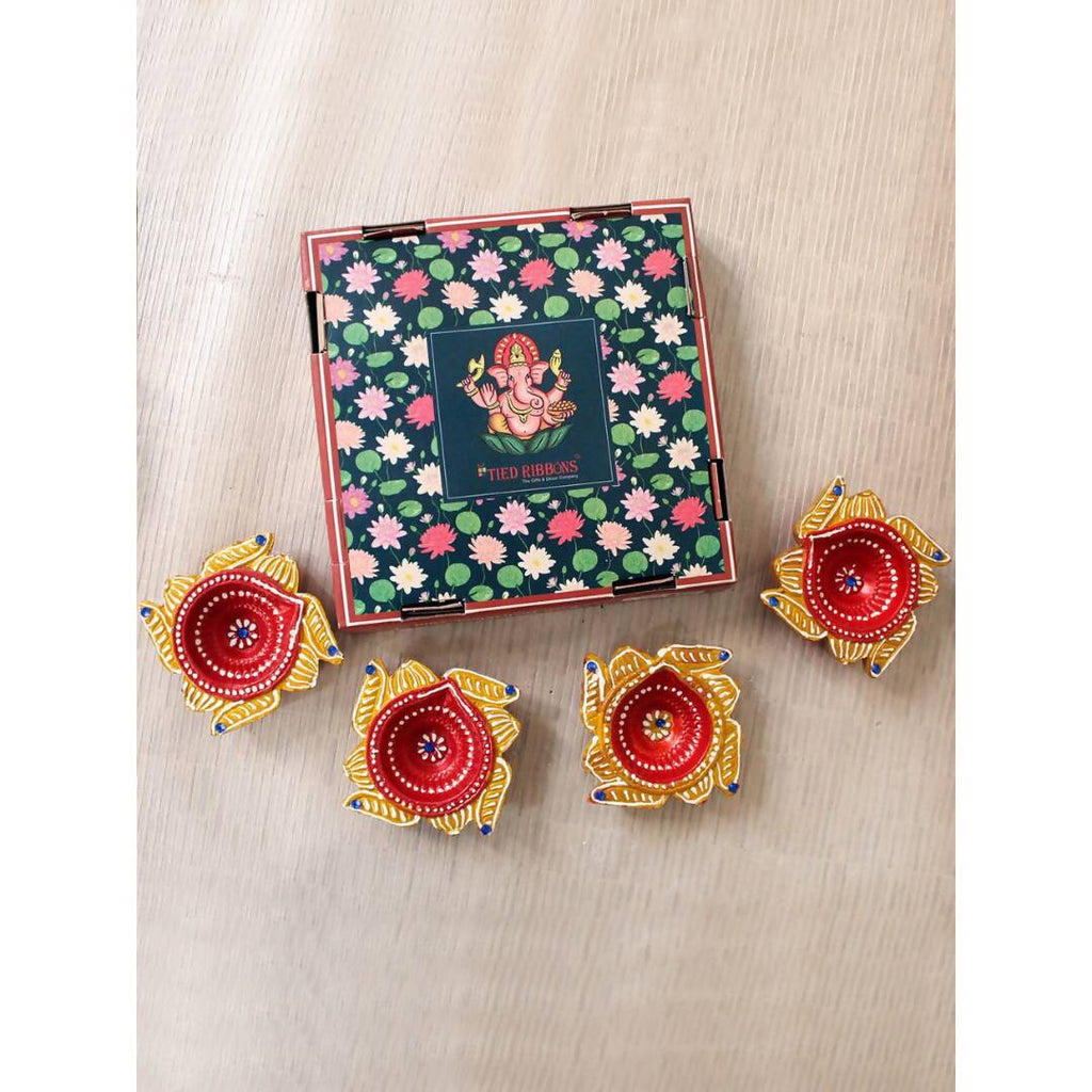 Tied Ribbons Set Of 4 Yellow & Red Printed Terracotta Diyas | Grocsy
