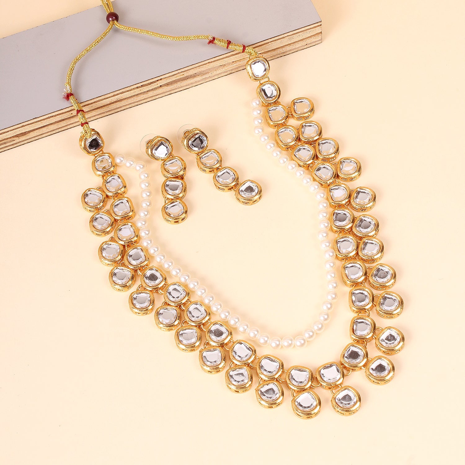 Divisha Alloy Gold-plated White Jewellery Set | Grocsy