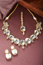 NVR Women's Gold Kundan-Studded Necklace and Earrings with Mang Tikka | Grocsy