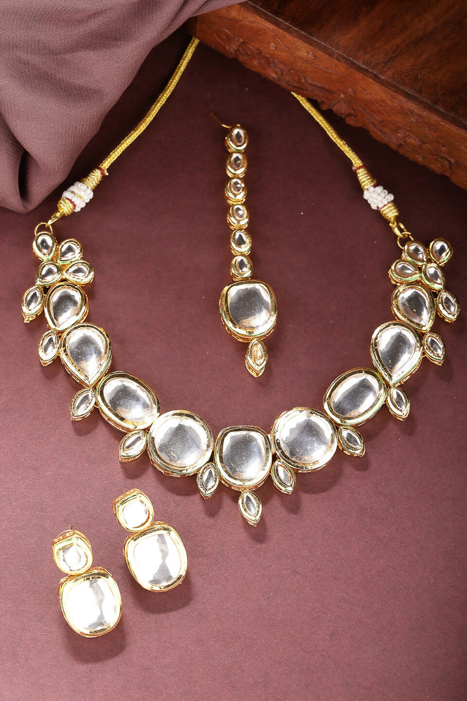 NVR Women's Gold Kundan-Studded Necklace and Earrings with Mang Tikka | Grocsy