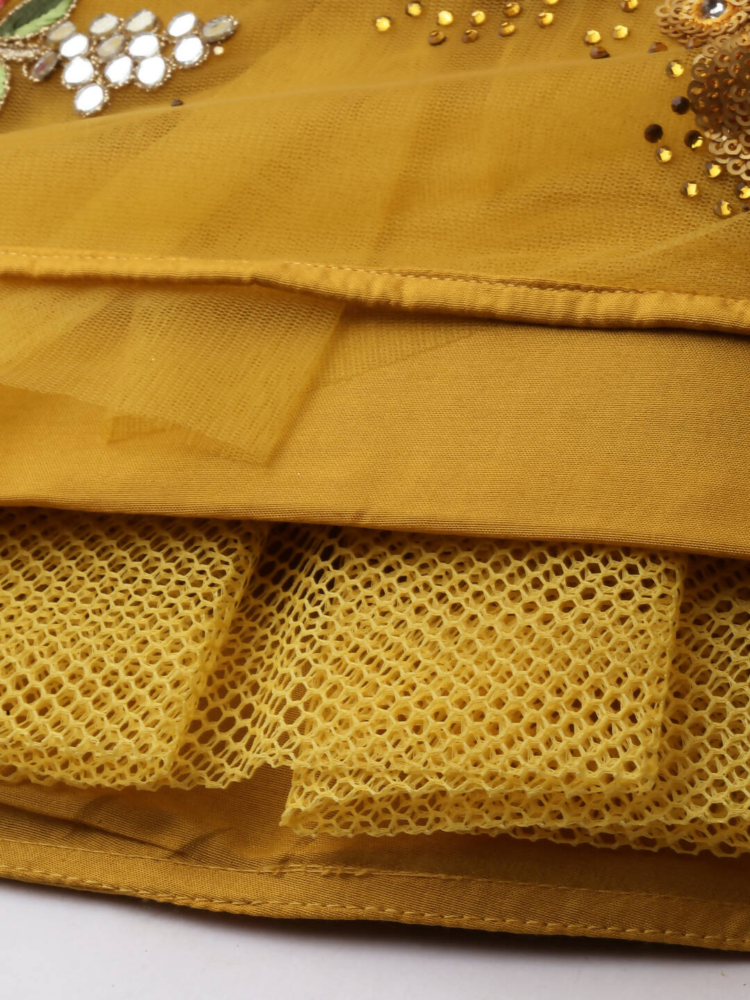 House of Panchhi Mustard Net Semi stitched Coding, Sequins & Saroski Stone Work Lehenga Choli | Grocsy