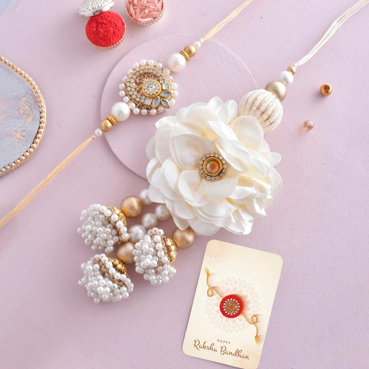 trueBrowns X Voylla White Pearls And Kundan Gems Bhaiya Bhabhi Lumba Rakhi | Grocsy