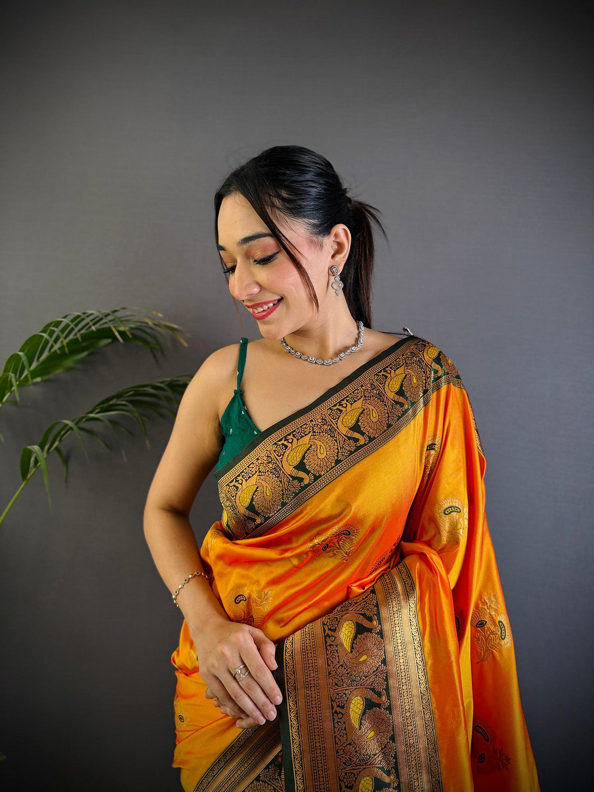 Elora Orange Soft Silk Floral Butta Zari Weaving Banarasi With Peacock Zari Weaving Border | Grocsy
