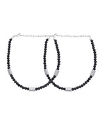 Jewels Nest Set of 2 Silver-Plated Anklets with Polished Black Beads and Barrel Charms | Grocsy