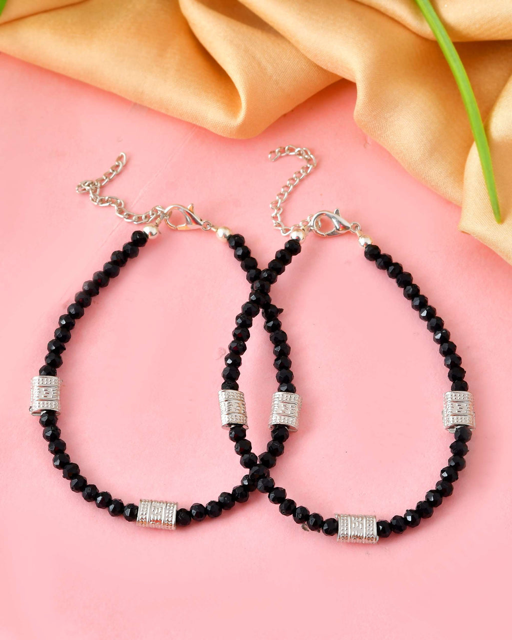 Jewels Nest Set of 2 Silver-Plated Anklets with Polished Black Beads and Barrel Charms | Grocsy