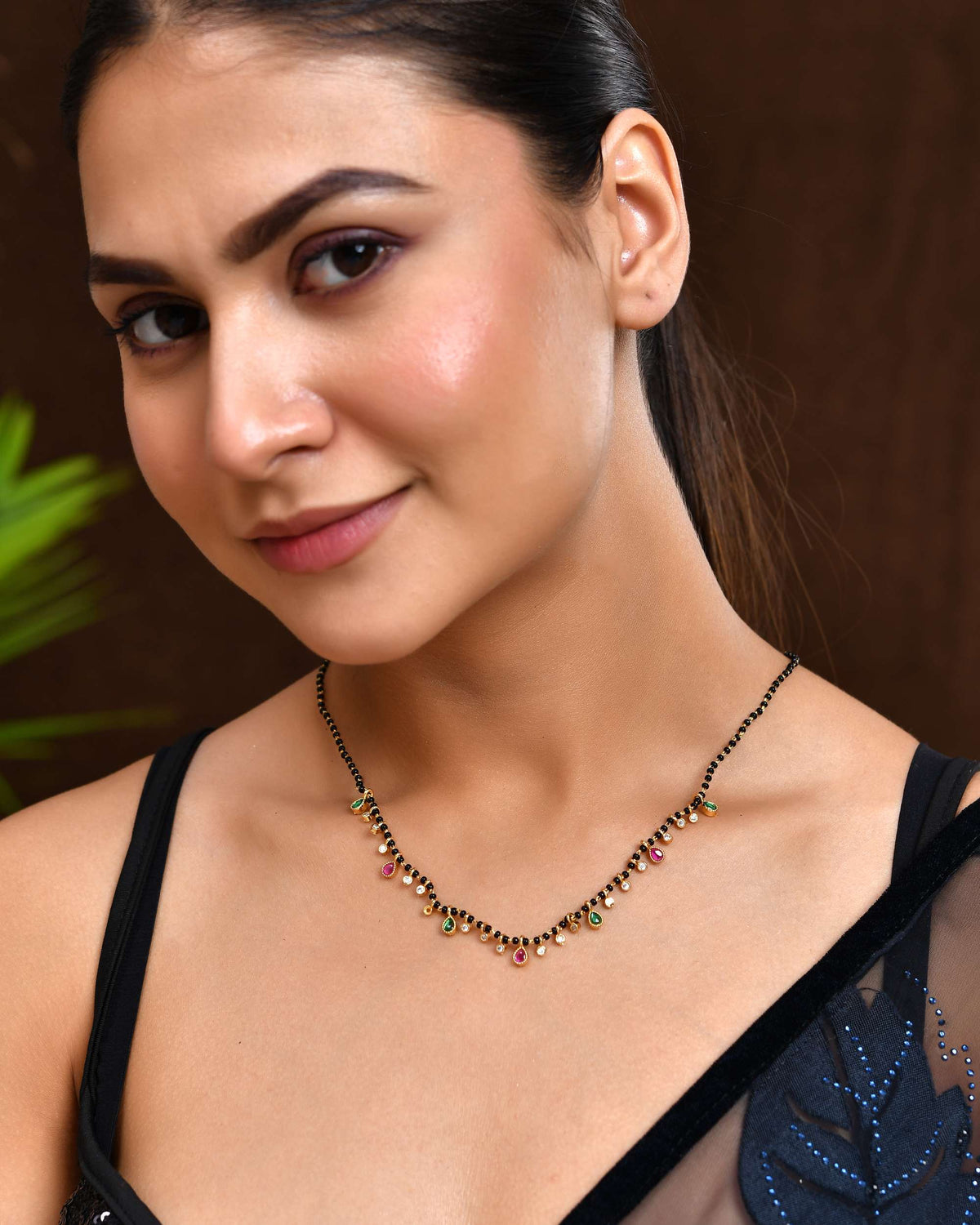 Jewels Nest Elegant Black Beads Mangalsutra with Green & Red Stone Drops – Silver Finish | Grocsy