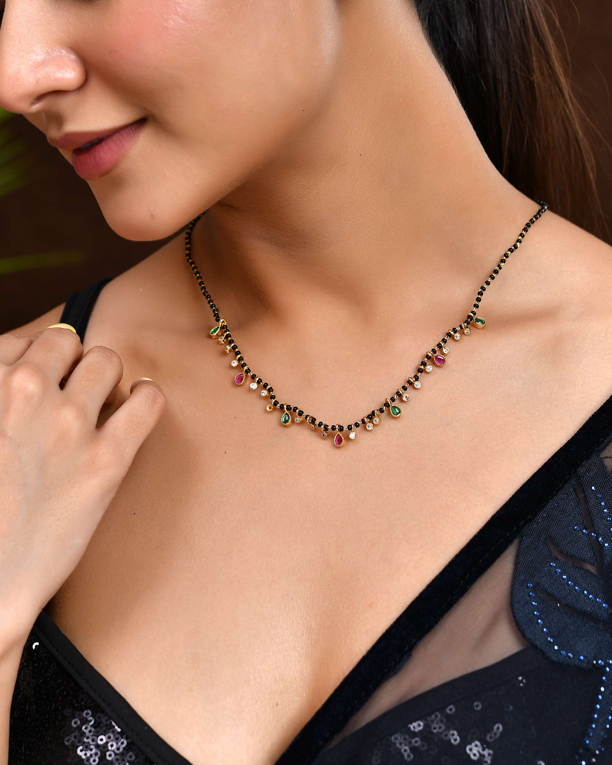 Jewels Nest Elegant Black Beads Mangalsutra with Green & Red Stone Drops – Silver Finish | Grocsy