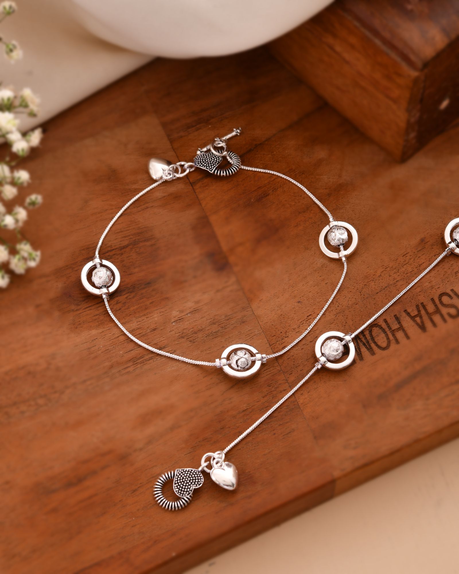 Jewels Nest Orbit Glow Silver Anklet With Circular Disc Accents And Heart Toggle Closure | Grocsy