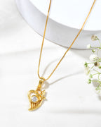 Jewels Nest Elegant Gold-Polished Couple Pendant Set | Grocsy
