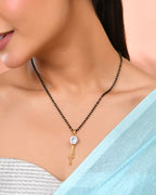Jewels Nest Classic Gold-Tone White Stone Mangalsutra With Single Drop Tassel Pendant | Grocsy