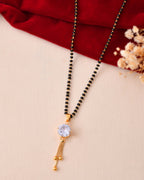 Jewels Nest Classic Gold-Tone White Stone Mangalsutra With Single Drop Tassel Pendant | Grocsy