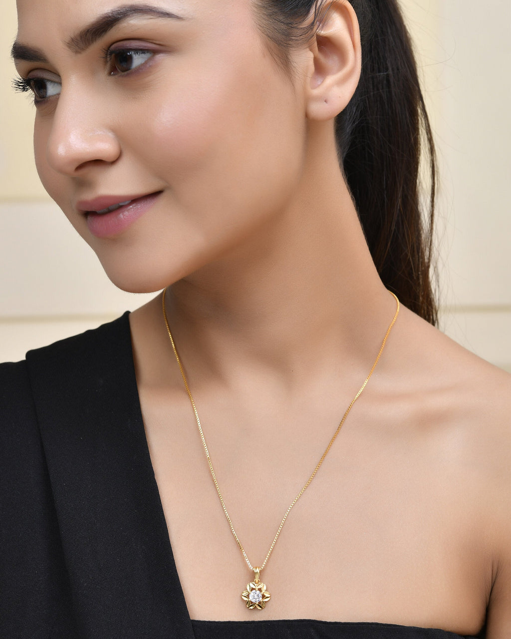 Jewels Nest Elegant Gold-Polished Floral Pendant with Sparkling Stone | Grocsy