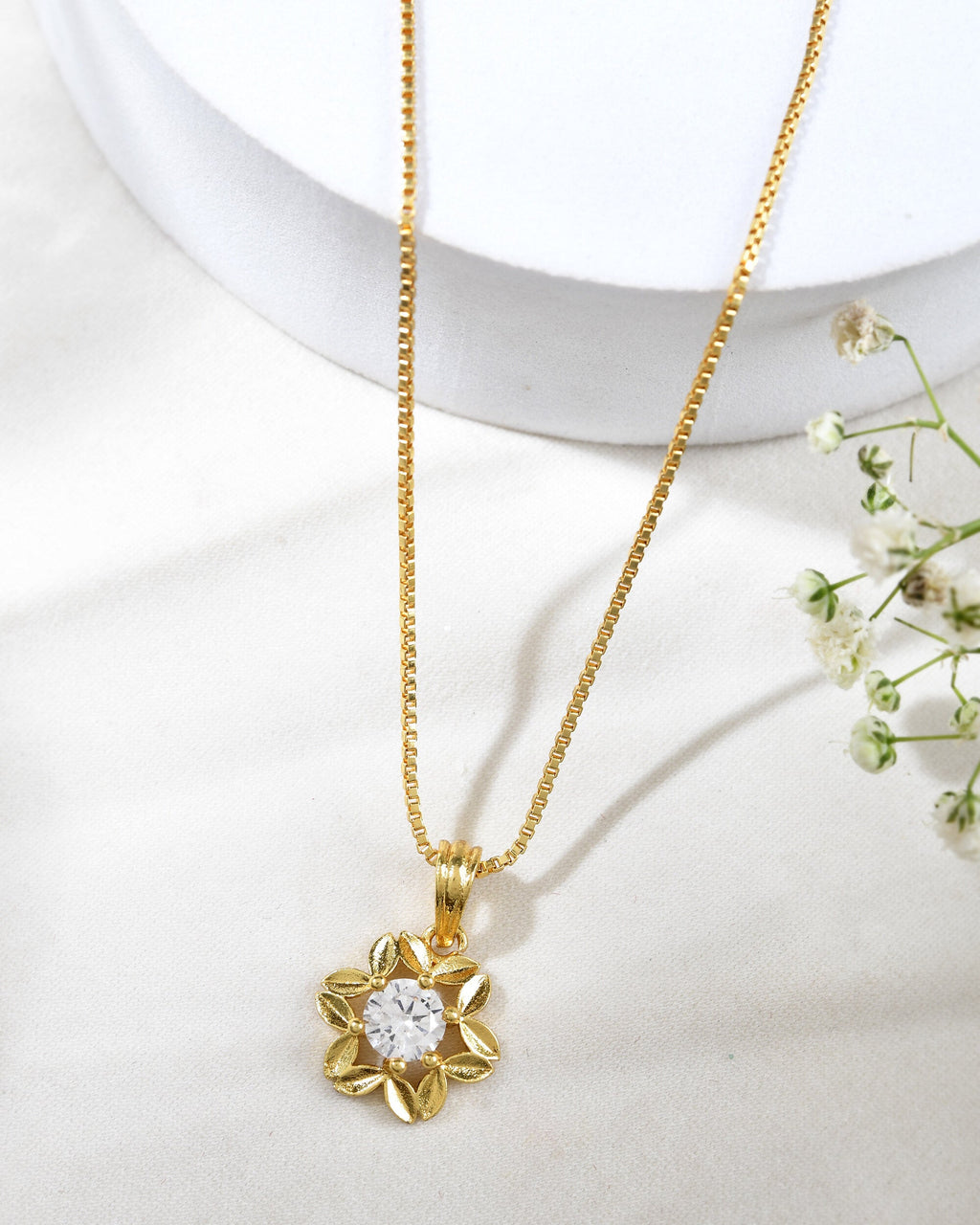 Jewels Nest Elegant Gold-Polished Floral Pendant with Sparkling Stone | Grocsy
