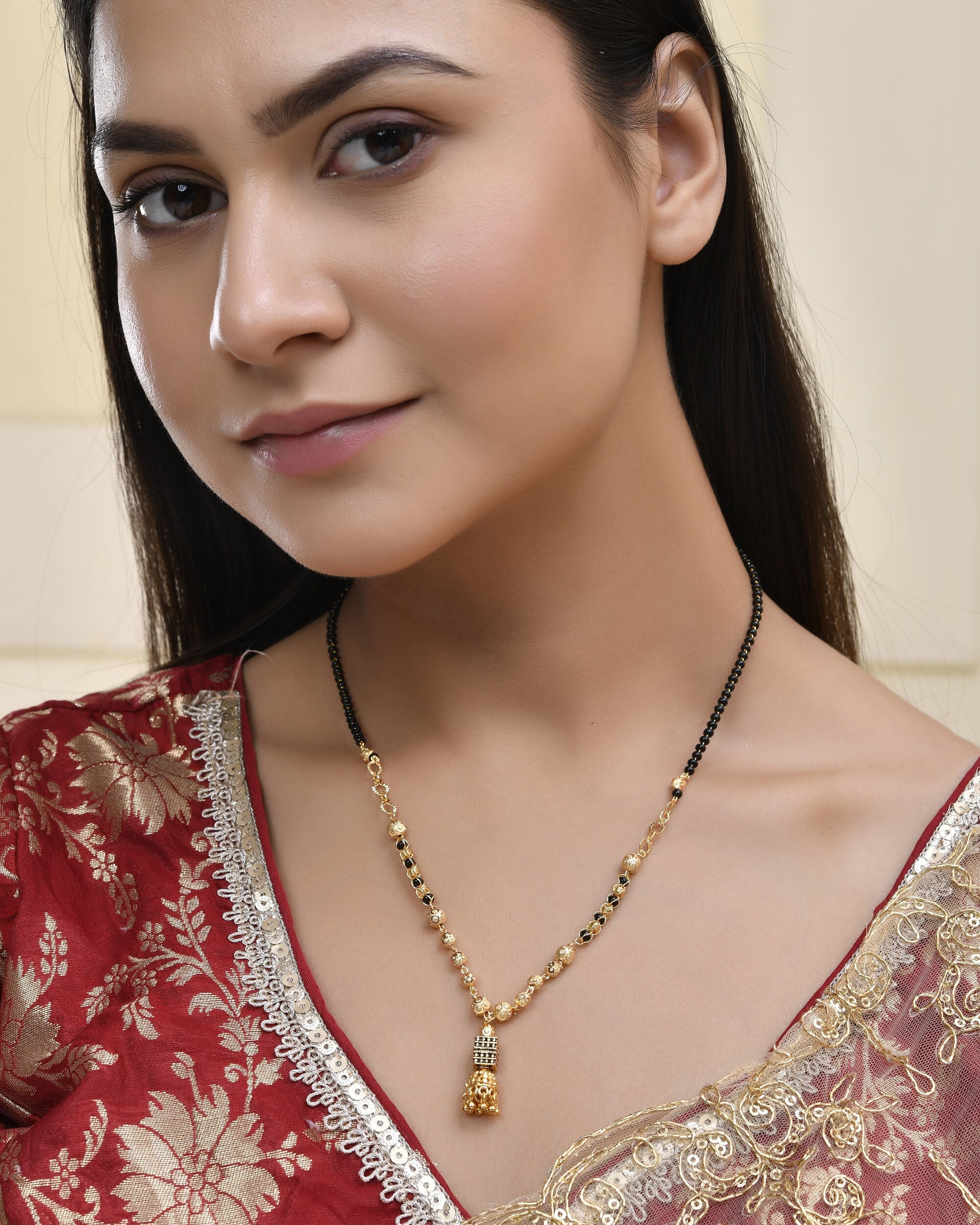 Jewels Nest Graceful Gold-Polished Black Bead Mangal Sutra with Intricate Pendant | Grocsy