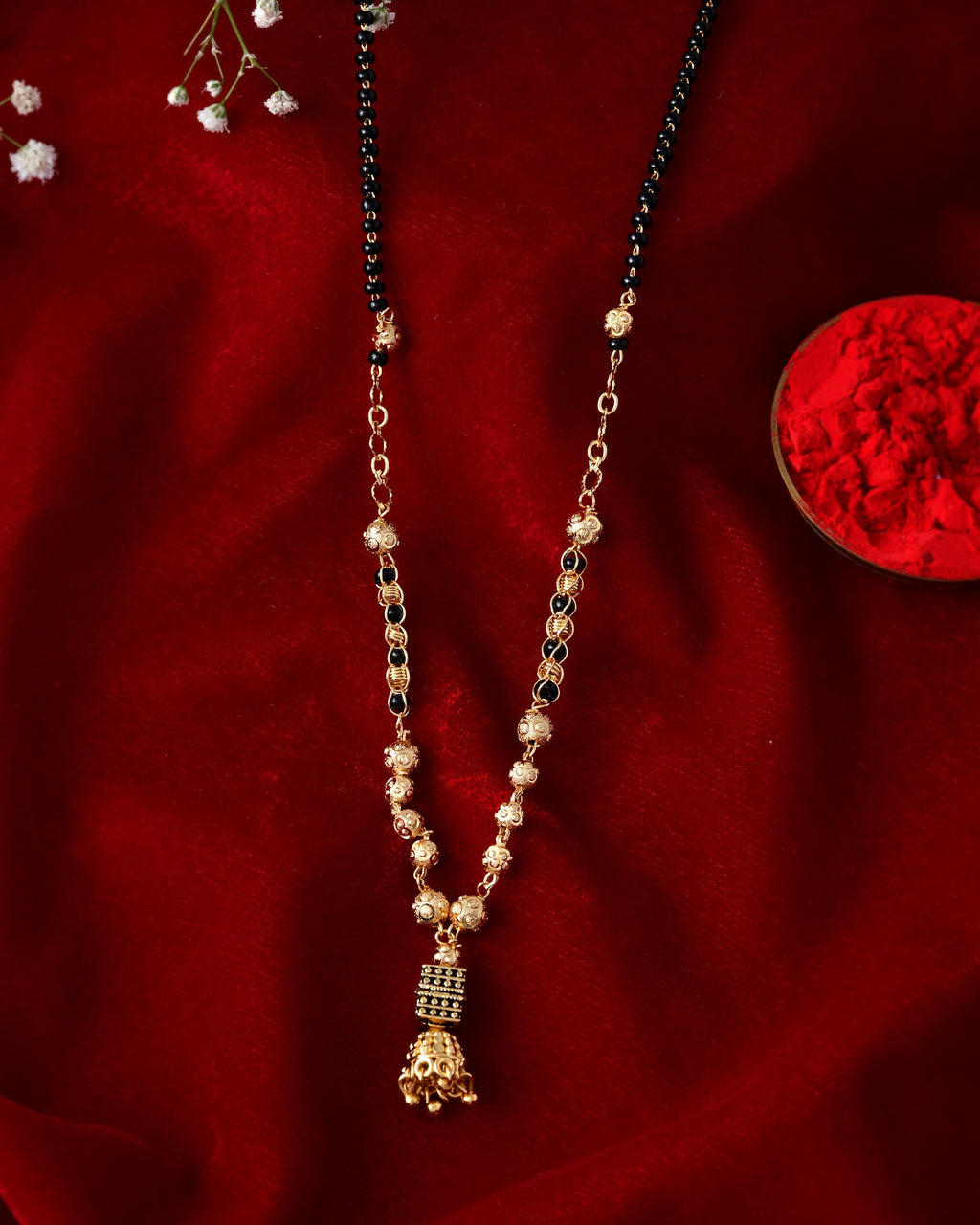 Jewels Nest Graceful Gold-Polished Black Bead Mangal Sutra with Intricate Pendant | Grocsy