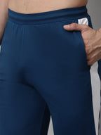 Jainish Men's Peacock Blue and White Striped Streachable Lycra Trackpants | Grocsy