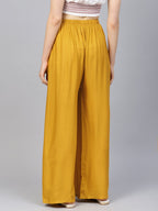 Jompers Women Mustard Solid Straight Palazzos | Grocsy