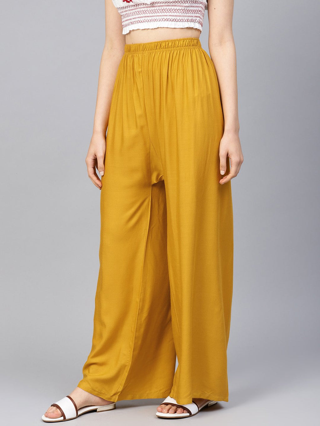 Jompers Women Mustard Solid Straight Palazzos | Grocsy