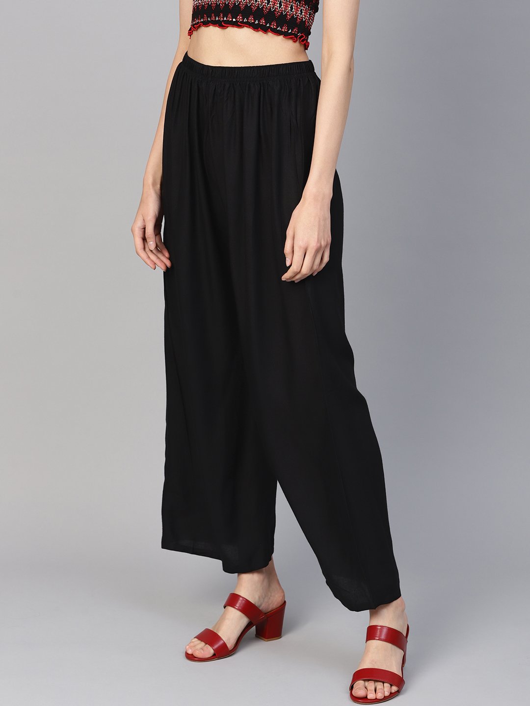 Jompers Women Black Solid Straight Palazzos | Grocsy