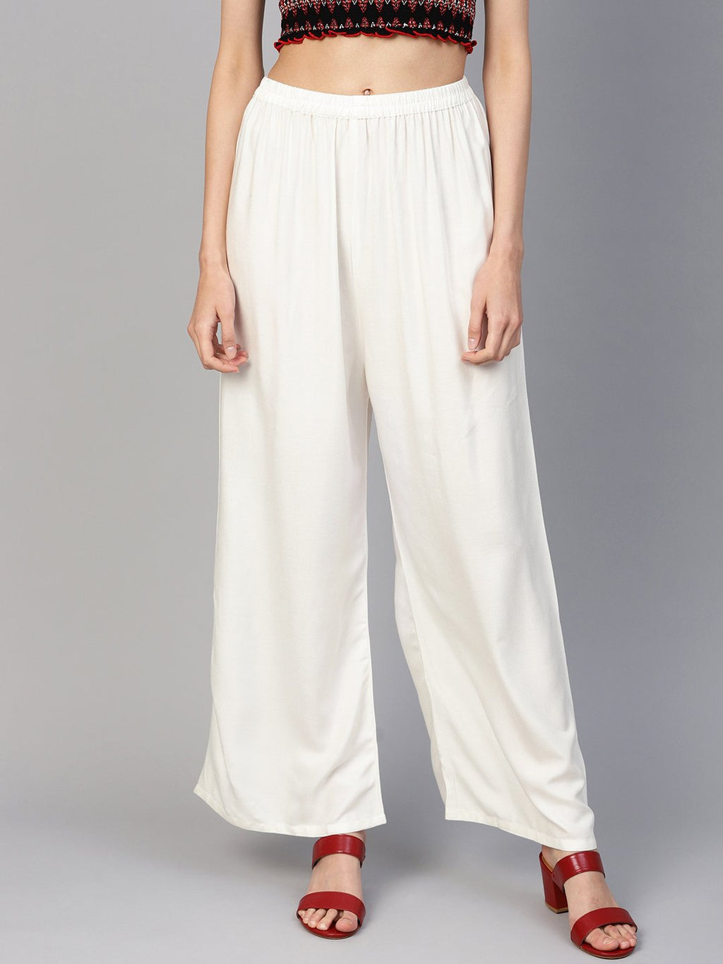 Jompers Women Off-White Solid Straight Palazzos | Grocsy