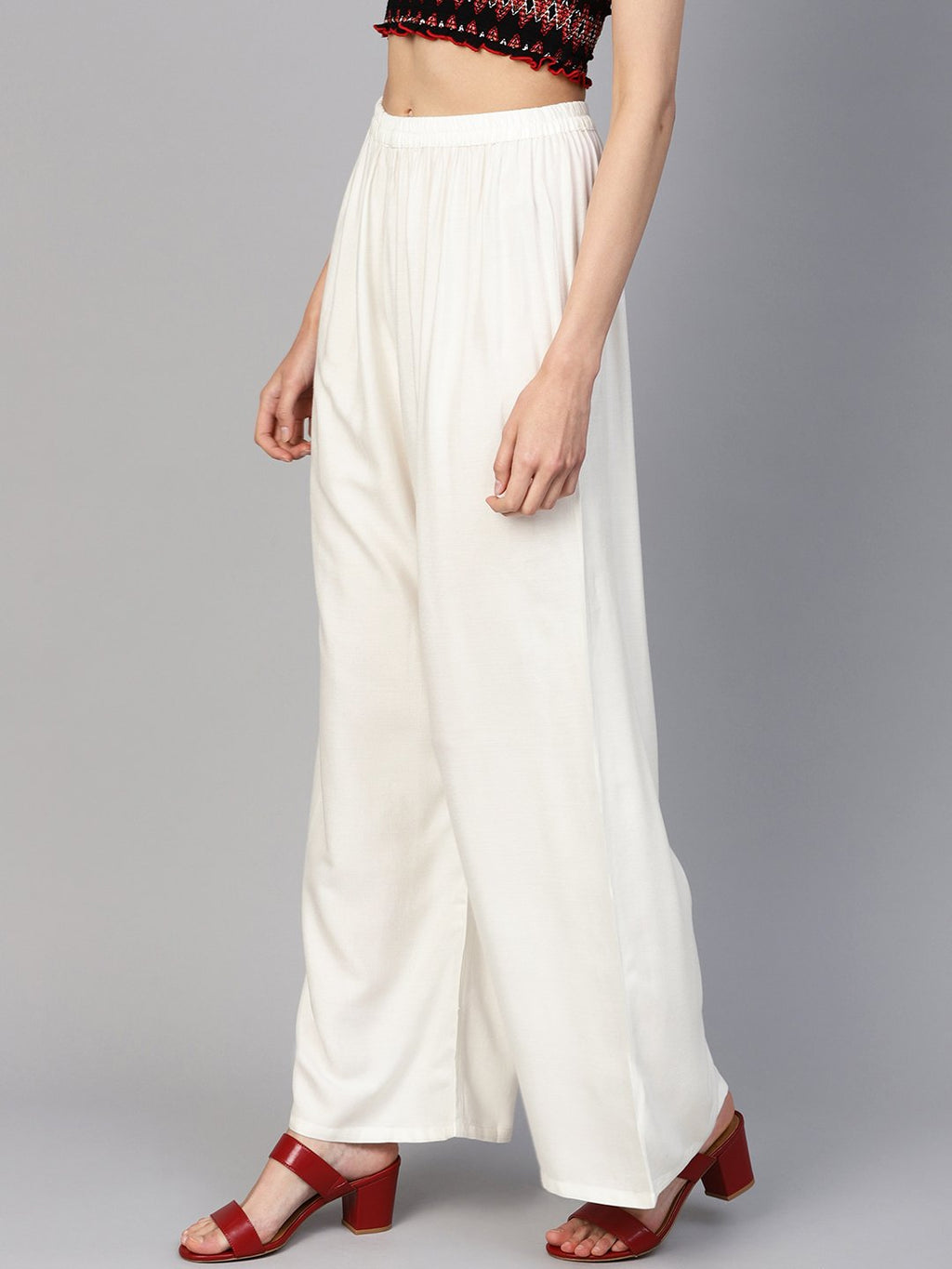 Jompers Women Off-White Solid Straight Palazzos | Grocsy