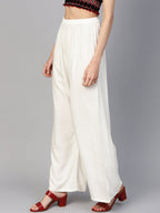 Jompers Women Off-White Solid Straight Palazzos | Grocsy